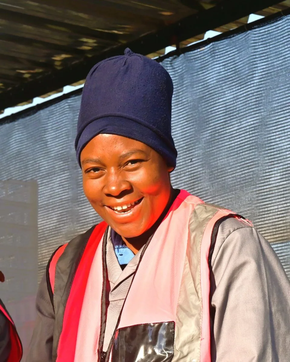 A member of the harvest team at the packing station